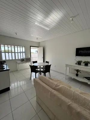 Uma televisão e/ou sistema de entretenimento em Apartamento Orquídea