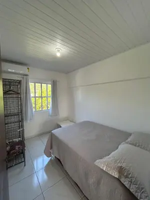 Uma cama ou camas num quarto em Apartamento Orquídea