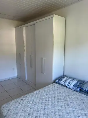 Uma cama ou camas num quarto em Apartamento Orquídea