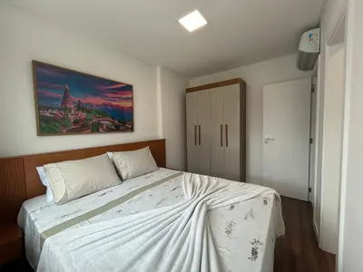 Uma cama ou camas num quarto em Apto 3 quartos garagem e churrasqueira