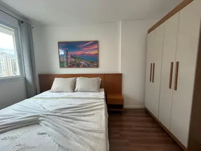 Uma cama ou camas num quarto em Apto 3 quartos garagem e churrasqueira