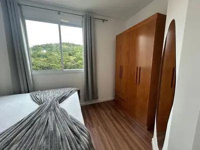 Uma cama ou camas num quarto em Apto 3 quartos garagem e churrasqueira
