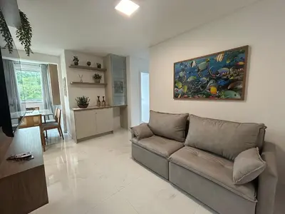 Uma área de estar em Apto 3 quartos garagem e churrasqueira