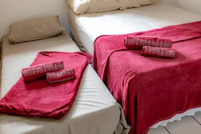 Uma cama ou camas num quarto em Apartamento com Varanda, Churrasqueira e Vista Mar