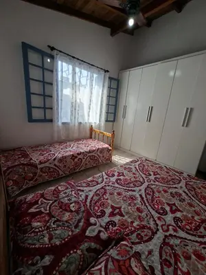 Uma cama ou camas num quarto em Casa Sol e Mar