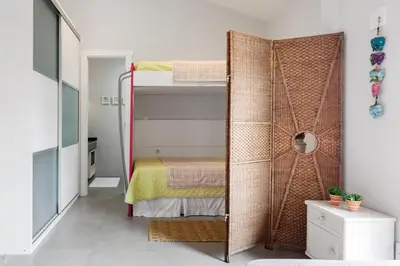 Uma cama ou camas num quarto em Casa mediterrânea de dois andares, no condomínio Villa dos Açores