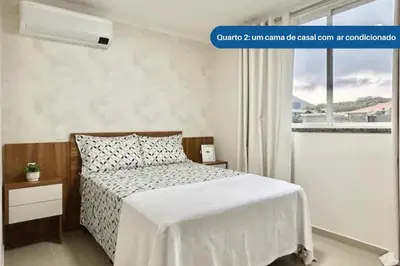 Uma cama ou camas num quarto em Apartamento 104 B com Piscina em Bombinhas