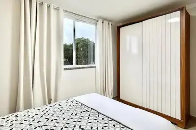 Uma cama ou camas num quarto em Apartamento 104 B com Piscina em Bombinhas