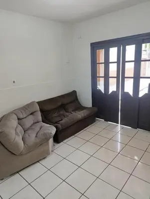 Uma área de estar em Casa em Itapema