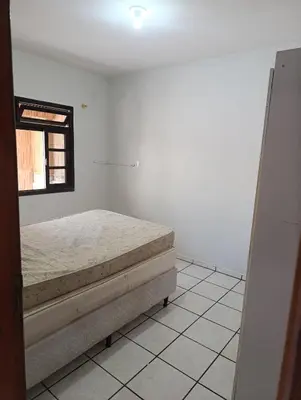 Uma cama ou camas num quarto em Casa em Itapema