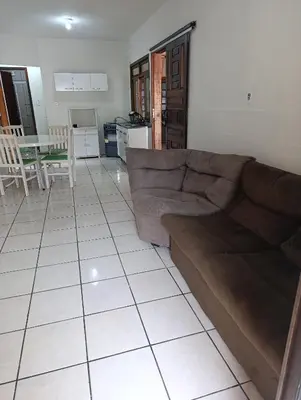 Uma área de estar em Casa em Itapema