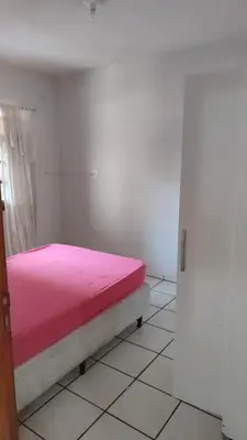 Uma cama ou camas num quarto em Casa em Itapema