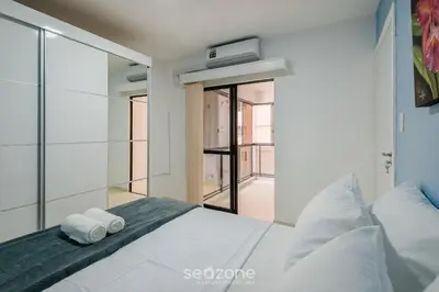 Uma cama ou camas num quarto em Apto em B.C a poucos passos da Praia CEC0501