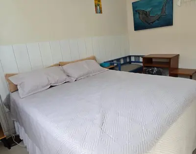 Uma cama ou camas num quarto em Aconchego em Bombinhas com Piscina