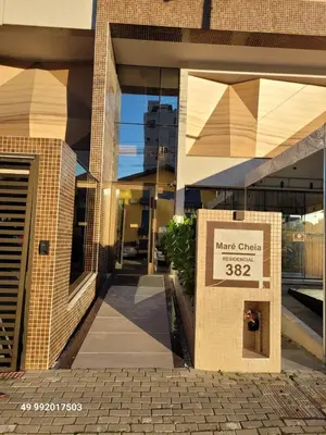 A fachada ou entrada de 2 suites, completo, luxo, piscina aquecida condominio, 1 quadra mar, ideal para descansar