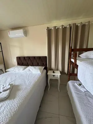 Uma cama ou camas num quarto em Residencial lara 1