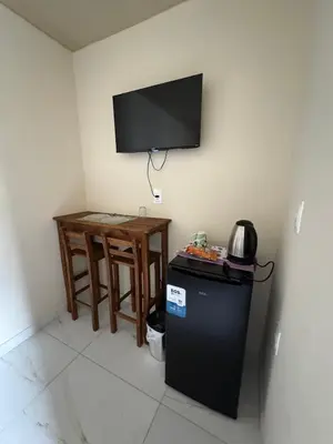 Uma televisão e/ou sistema de entretenimento em Residencial lara 1