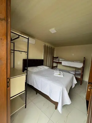 Uma cama ou camas num quarto em Residencial lara 1