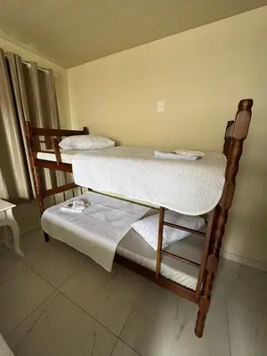 Uma cama ou camas num quarto em Residencial lara 101