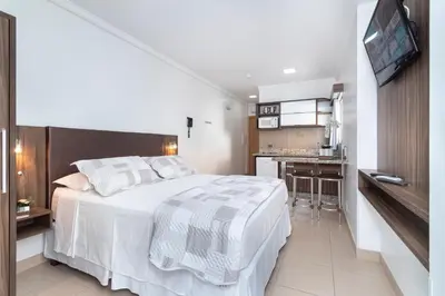 Uma cama ou camas num quarto em Pousada Riviera Bombinhas