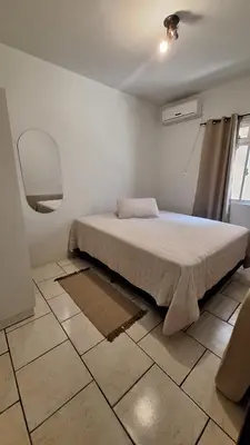 Uma cama ou camas num quarto em Apartamento Morrinhos