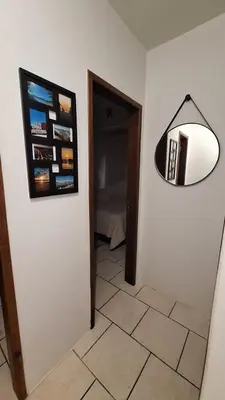 Uma televisão e/ou sistema de entretenimento em Apartamento Morrinhos