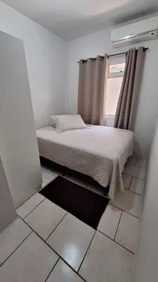 Uma cama ou camas num quarto em Apartamento Morrinhos