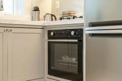 A cozinha ou kitchenette de Achei Itapema • Vernon Classic Residencial, R.244