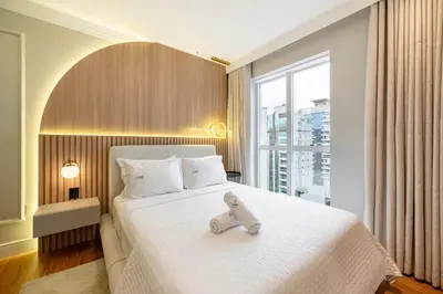 Uma cama ou camas num quarto em Achei Itapema • Vernon Classic Residencial, R.244