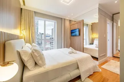 Uma cama ou camas num quarto em Achei Itapema • Vernon Classic Residencial, R.244