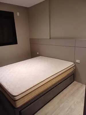 Uma cama ou camas num quarto em Apto em Itapema com acesso a piscinas,sendo uma aquecida e academia