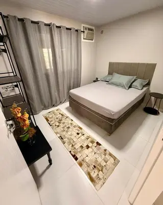 Uma cama ou camas num quarto em Casa charmosa praia Itapema