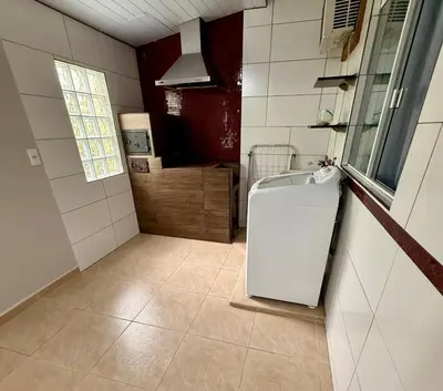 A cozinha ou kitchenette de Casa charmosa praia Itapema
