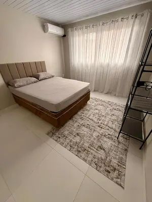Uma cama ou camas num quarto em Casa charmosa praia Itapema