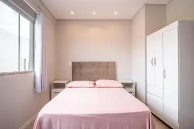 Uma cama ou camas num quarto em Casa 01 | 2 suítes | até 7 pessoas