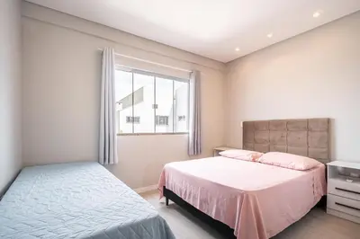 Uma cama ou camas num quarto em Casa 01 | 2 suítes | até 7 pessoas