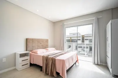 Uma cama ou camas num quarto em Casa 01 | 2 suítes | até 7 pessoas