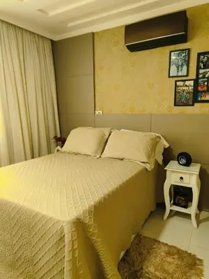 Uma cama ou camas num quarto em coração de Balneário Camboriú