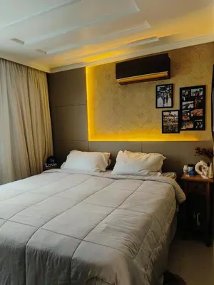 Uma cama ou camas num quarto em coração de Balneário Camboriú