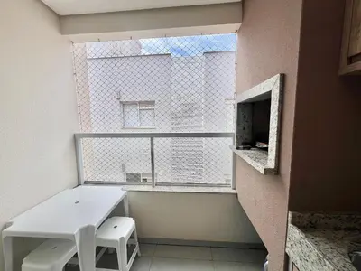 Uma televisão e/ou sistema de entretenimento em Lindo! Apto com piscina na praia de Palmas - CI02J