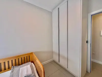 Uma cama ou camas num quarto em Lindo! Apto com piscina na praia de Palmas - CI02J