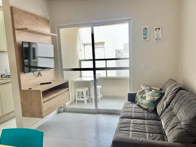 Uma televisão e/ou sistema de entretenimento em Lindo! Apto com piscina na praia de Palmas - CI02J