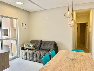 Uma área de estar em Lindo! Apto com piscina na praia de Palmas - CI02J