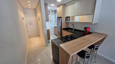 A cozinha ou kitchenette de Apartamento Lindo em Palmas com Piscina 200m do mar