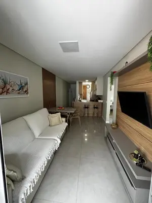 Uma televisão e/ou sistema de entretenimento em Apartamento Lindo em Palmas com Piscina 200m do mar