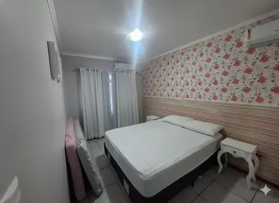 Uma cama ou camas num quarto em Apartamento a Beira Mar em Meia Praia