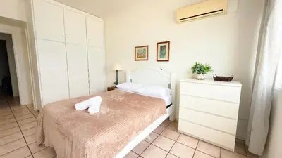 Uma cama ou camas num quarto em ASA | Frente Mar | Pé na Areia | 4QT | BC