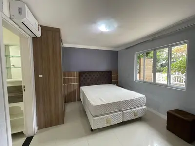 Uma cama ou camas num quarto em Casa para 9 pessoas - Bombinhas Centro