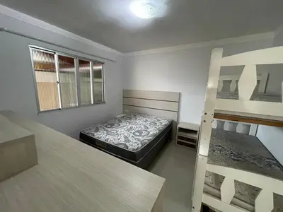 Uma cama ou camas num quarto em Casa para 9 pessoas - Bombinhas Centro
