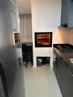 A cozinha ou kitchenette de Apartamento lindo e super confortável em itapema